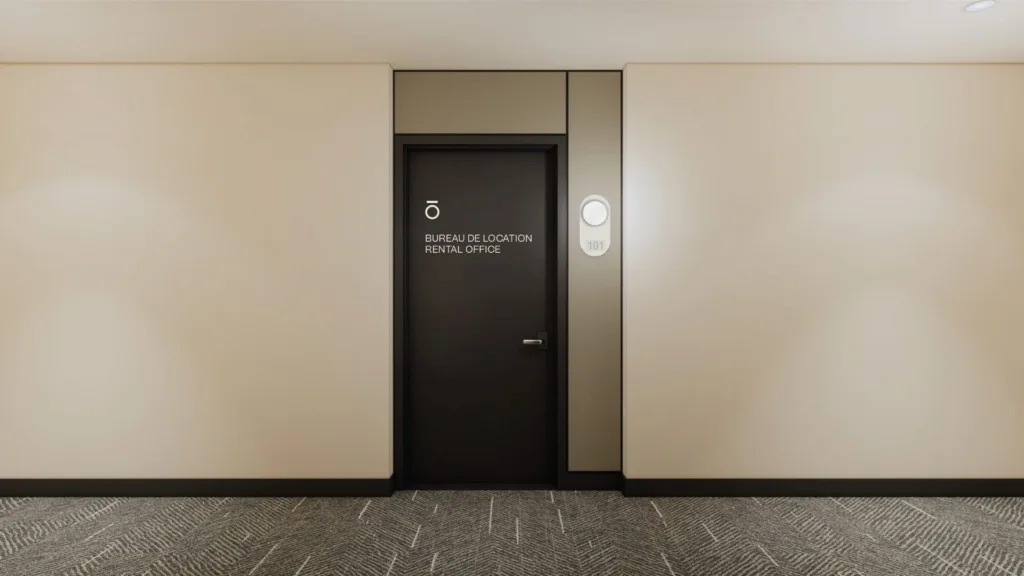Couloir d'un immeuble Hallō avec porte et signalétique de logement